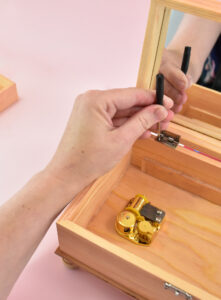 Put the jewelry box back together, screwing the lid and base together with the hinges.