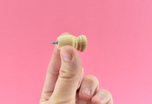 Drill your #6 1-1/4" screw all the way into the cap of the dowel end. 
