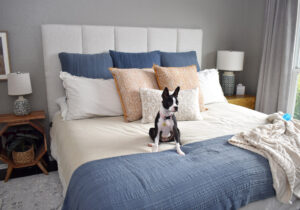 It's so easy to make a DIY Channel Tufted Headboard in any size! Get our full tutorial and save money and cozy up your bedroom at the same time!