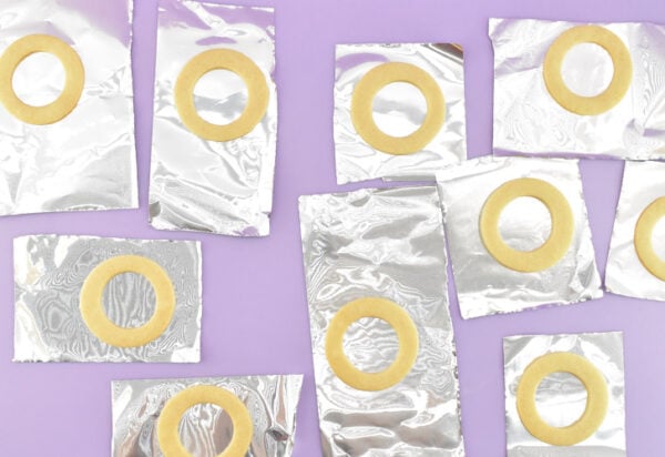 Wearing your disposable gloves, and while the isomalt is still and not bubbling, gently pour into the centers of the cookies taking care not to overfill. Allow the isomalt time to set, about 5-10 minutes. Leave the cookies on the foil until you're ready to build your cookies.