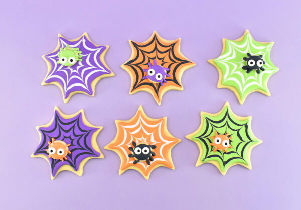 Using minimal supplies, these DIY Halloween spiderweb cookies are super cute and easy for even a new cookier! Get the full step by step directions to make these awesome Halloween decorated sugar cookies.