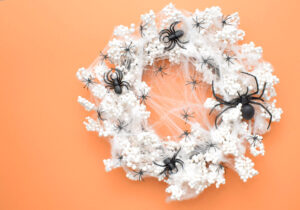 This amazing Spiderweb Halloween Wreath comes together in minutes and requires no glue. Get the spooky & sinfully simple DIY!
