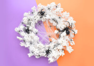 This amazing Spiderweb Halloween Wreath comes together in minutes and requires no glue. Get the spooky & sinfully simple DIY!