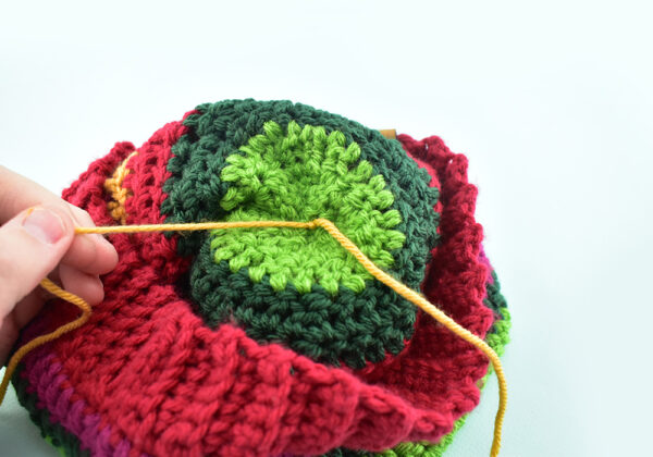 Grab both tails and create 2 simple overhand knots.