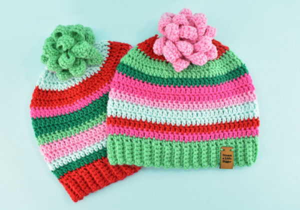 Make a simple crochet gift bow great for hats or gifts. This stash-busting beginner friendly crochet project only takes about an hour!