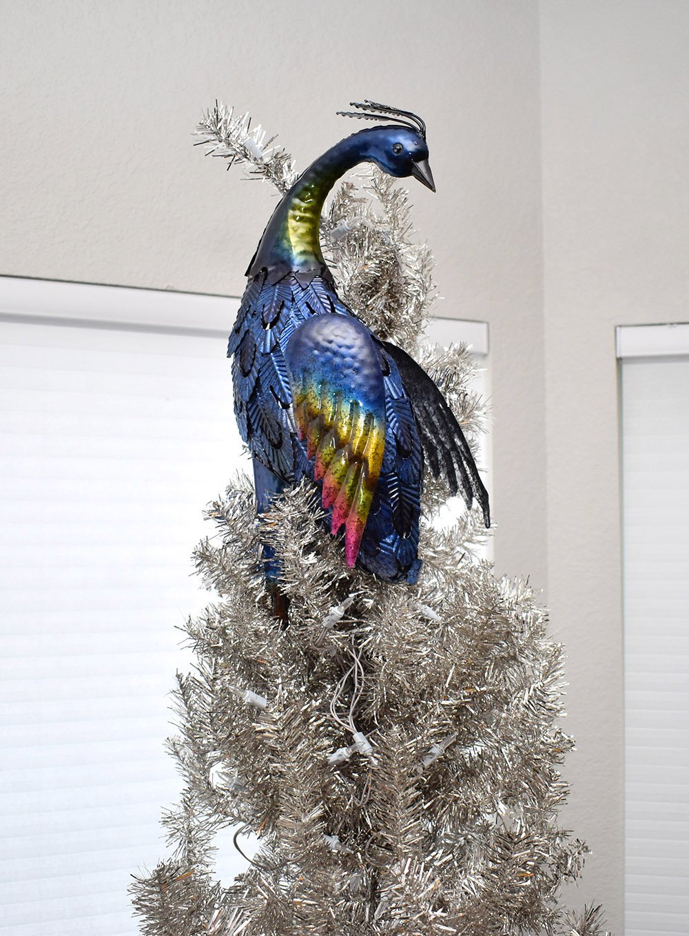 Ever wonder how to attach a lawn statue to a Christmas tree? See how step by step with this full peacock Christmas tree tutorial.