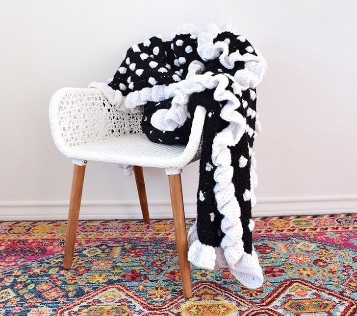 You only need to know basic crochet stitches to hook up this gorgeously girly ruffled edge polka dot crochet afghan that is easy enough for beginners!