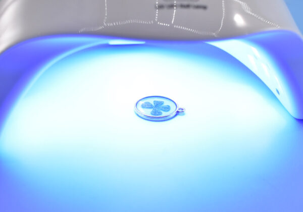 Cure each layer of resin beneath a UV lamp (like used in nail art).