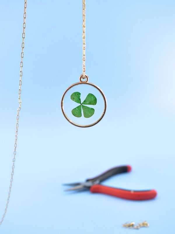 String the pendant onto a chain to create a necklace.