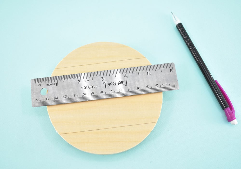 Take a ruler and and match up the sides (nearer the top edge) to measure exactly 4 inches and mark a line. Mark another line at 4" moving up from the bottom of the circle, making sure the two lines are parallel and not wonky. 