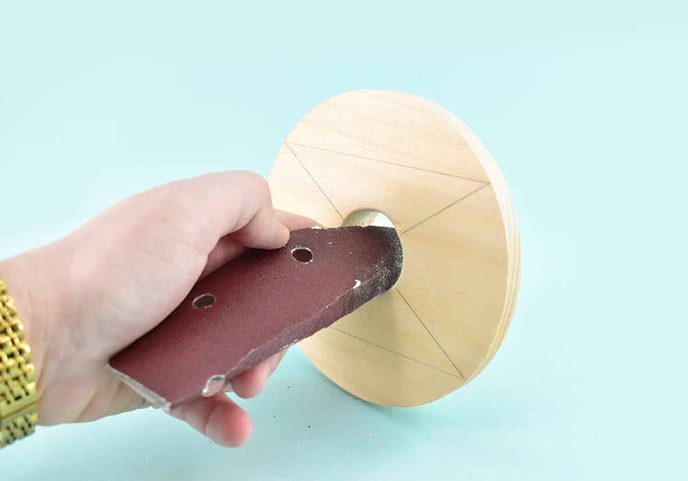 Using a piece of sandpaper clean up any jagged edges.