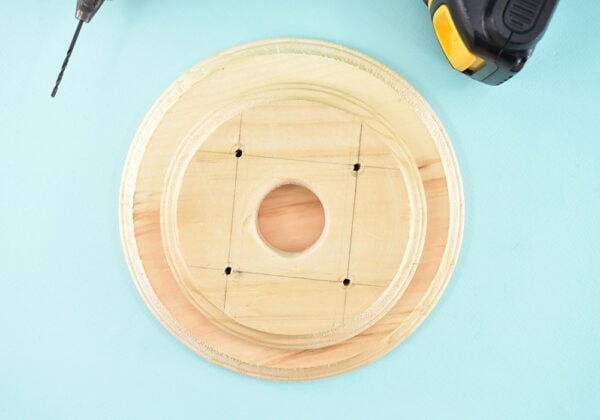 Place the smaller circle on top of the larger, both with beveled sides facing up, and center the two pieces as well as you can.