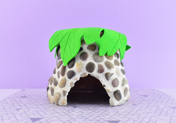Place your clay leaf on top with the textured side facing up and moving until you're happy with the placement. Gently press the clay into the pot around the edges to mold it to the shape.