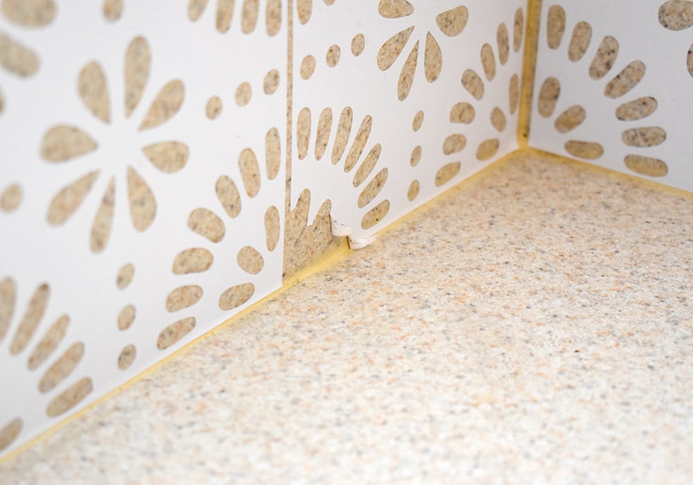 Want to update your kitchen on a budget? See how we made our own DIY peel and stick backsplash tile for a whole new look!
