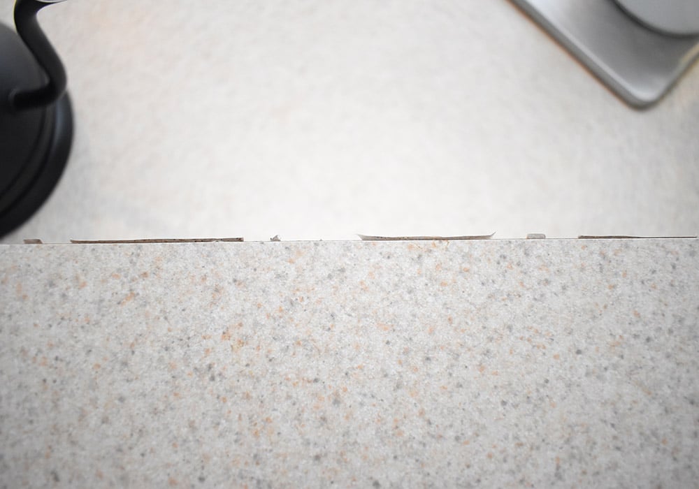 Want to update your kitchen on a budget? See how we made our own DIY peel and stick backsplash tile for a whole new look!