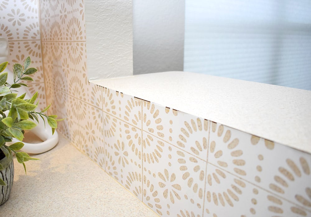 Want to update your kitchen on a budget? See how we made our own DIY peel and stick backsplash tile for a whole new look! See how well it lasted after 2 years of heavy use!