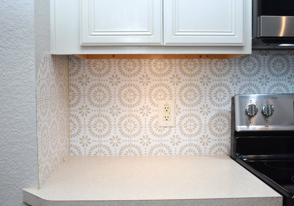 Want to update your kitchen on a budget? See how we made our own DIY peel and stick backsplash tile for a whole new look!