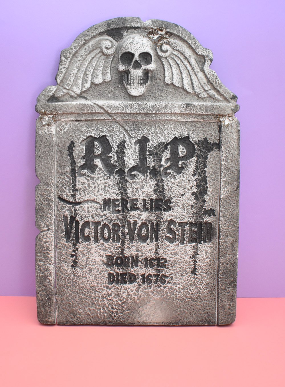 This Store-Bought Tombstone Makeover is a quick an easy way to make a faux Halloween graveyard!