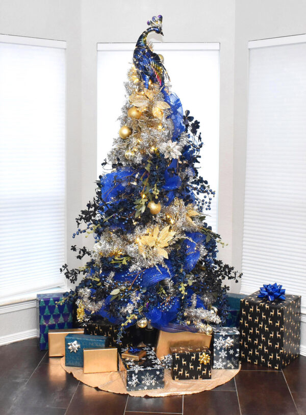 Looking for a unique and elegant Christmas tree? This peacock tree follows a peacock's tail from the top where the bird perches to the bottom. When displayed with a rotating base, the sight is magical!