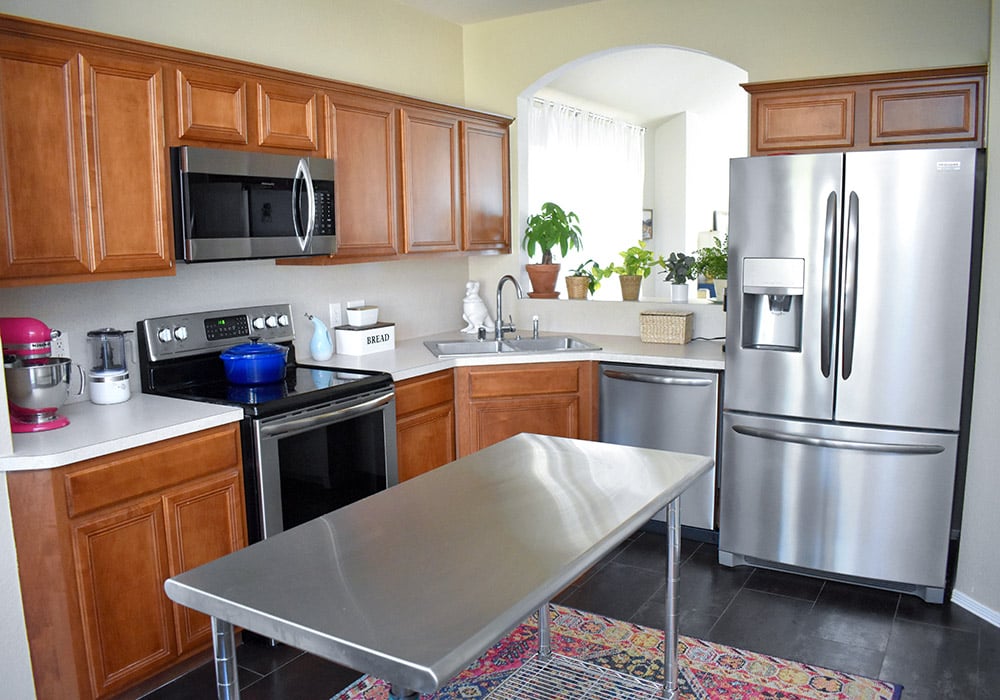 Want to update your kitchen on a budget? See how we made our own DIY peel and stick backsplash tile for a whole new look!