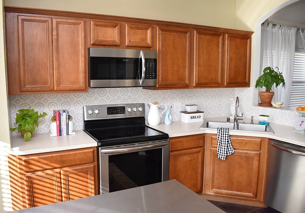 Want to update your kitchen on a budget? See how we made our own DIY peel and stick backsplash tile for a whole new look!