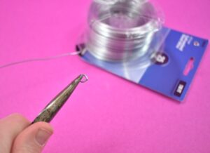 Make a ring to attach your tags with wire and pliers out of the garage.
